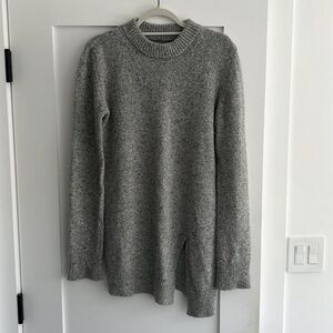 Grey tunic sweater with asymmetrical front slit detail